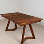 walnut extendable table on walnut chevron legs