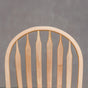 back detail of a hoop back dining chair made of Maple with a Pure D finish
