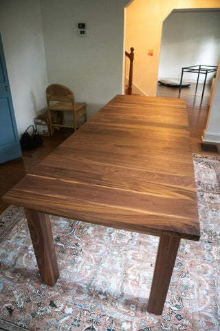 walnut center extension table on parsons base
