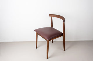midcentury walnut dining chair with wine colored faux leather seat