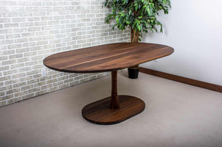 blackened walnut racetrack oval table on pedestal base