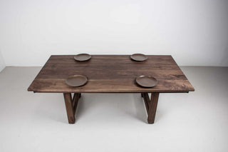 large extendable farmhouse table in blackened walnut on chunky H legs