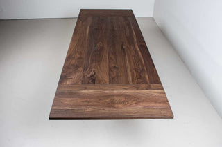 large extendable farmhouse table in blackened walnut on chunky H legs