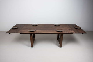 large extendable farmhouse table in blackened walnut on chunky H legs