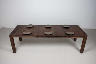 blackened walnut extendable table on modern exposed parsons base