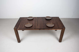 blackened walnut extendable table on modern exposed parsons base