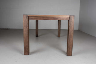 blackened walnut extendable table on modern exposed parsons base