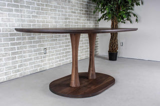 blackened walnut oval table on double pedestal base