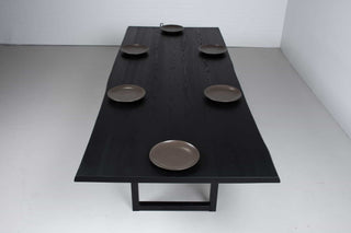 live edge ash table finished in black on square steel legs