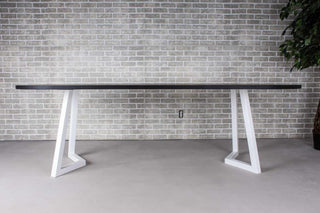 black oval oak dining table on white chevron legs