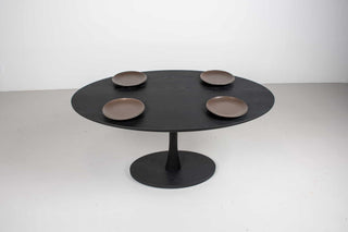 black oval table in ash wood on pedestal base