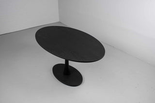 black oval table in ash wood on pedestal base