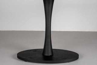 black oval table in ash wood on pedestal base