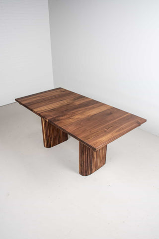 extendable walnut table on midcentury legs