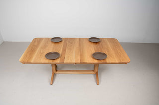 extendable oak dining table on traditional trestle base