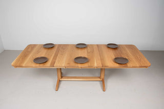 extendable oak dining table on traditional trestle base