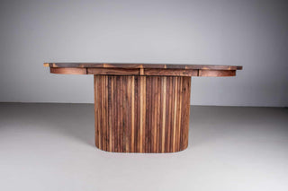 extendable oval table in walnut on a fluted walnut pedestal base