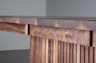 extendable oval table in walnut on a fluted walnut pedestal base