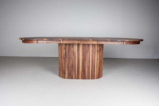 extendable oval table in walnut on a fluted walnut pedestal base