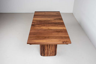 walnut extendable table on midcentury modern fluted legs