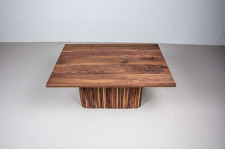 extendable walnut table on fluted pedestal base