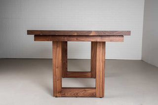 extendable walnut table on mid century modern legs
