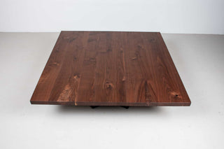 large square walnut coffee table on steel chevron legs