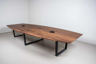 large squoval shaped walnut conference table