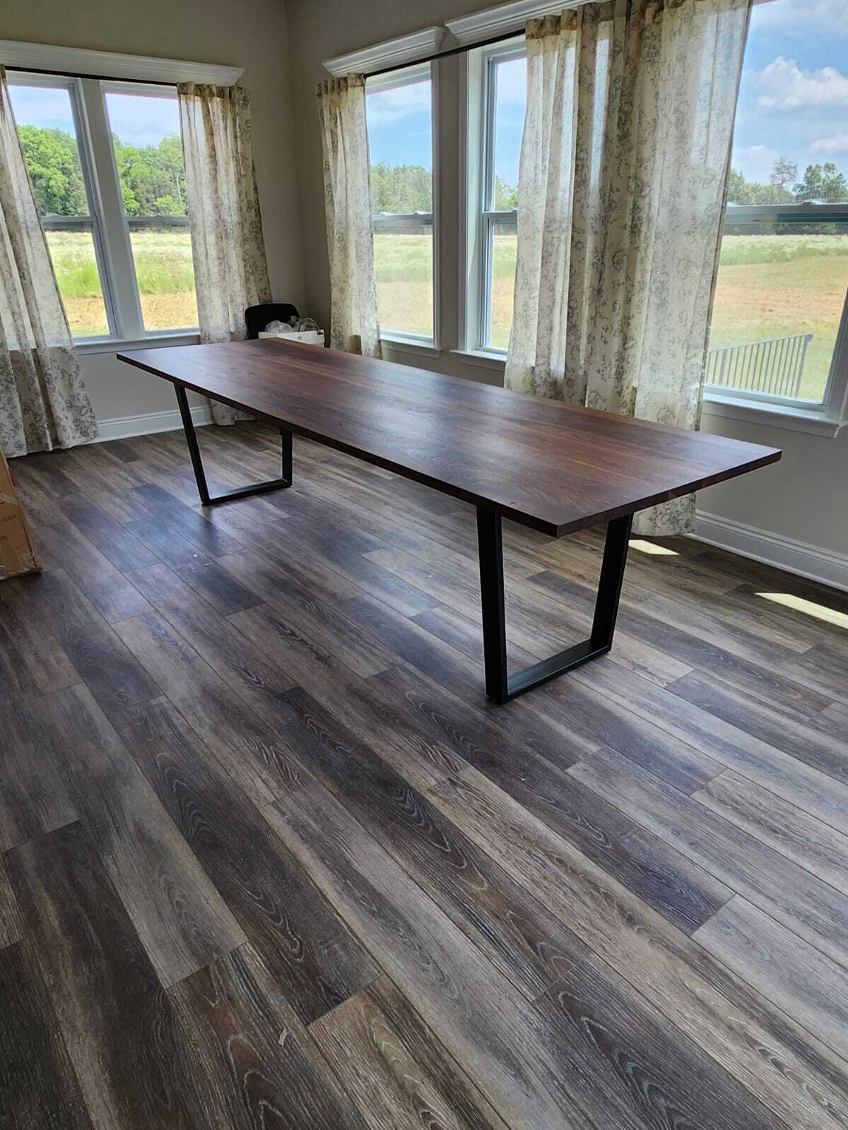 long walnut table on steel legs