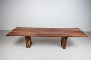 long walnut table on tambour style walnut legs