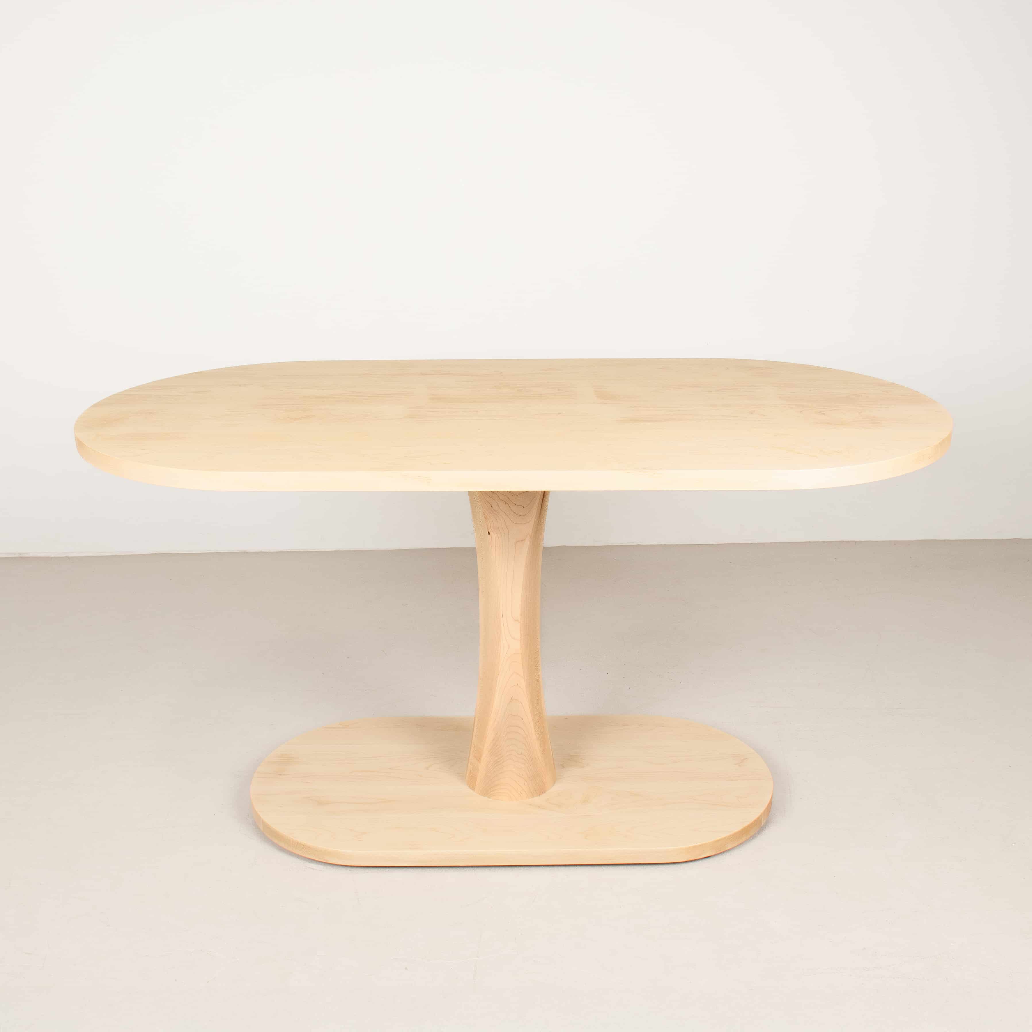 small oval table on a pedestal base