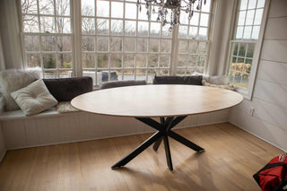 maple oval table on steel starburst base