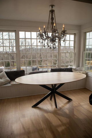 maple oval table on steel starburst base