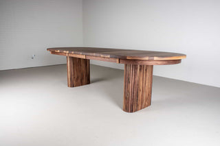 mid century extendable oval table on fluted walnut legs