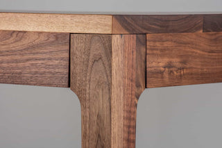 minimalist walnut dining table with a custom parsons base that is flush with the table top and has tapered legs