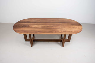 midcentury modern walnut oval table on matching double cross pedestal base