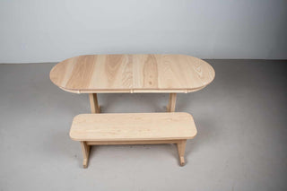narrow expandable wood kitchen table with bench in custom natural finish
