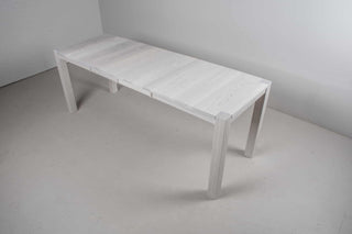 narrow extendable white ash dining table on modern parsons base