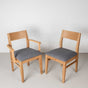 oak dining chairs finished in Pure D with gray fabric seats