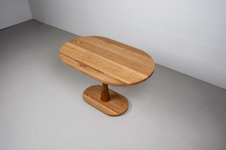 oak racetrack oval table on pedestal base