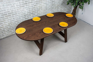 oval oak table on wood legs all finished in espresso
