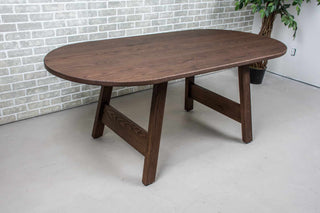 oval oak table on wood legs all finished in espresso