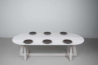 white ash oval table on double cross pedestal base
