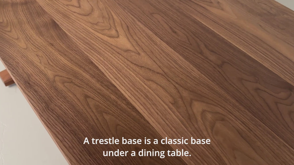 video of walnut dining table on trestle base
