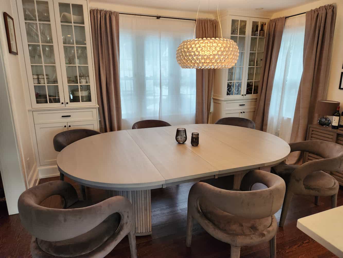 extended round pedestal table in gray
