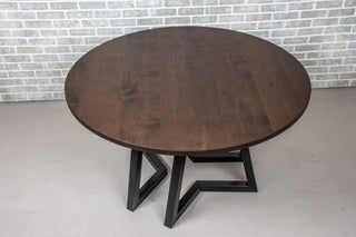 round maple table on chevron pedestal base