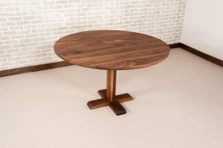 round walnut table on cafe style base