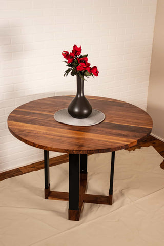 round walnut table on hybrid pedestal base