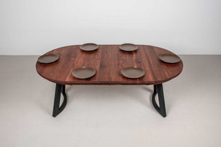 round expandable spiced walnut table on black maple chesbro legs