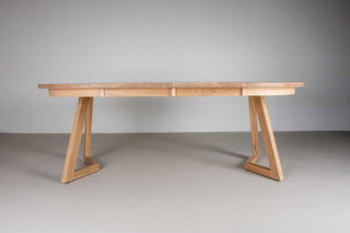 round oak extending table on wood legs